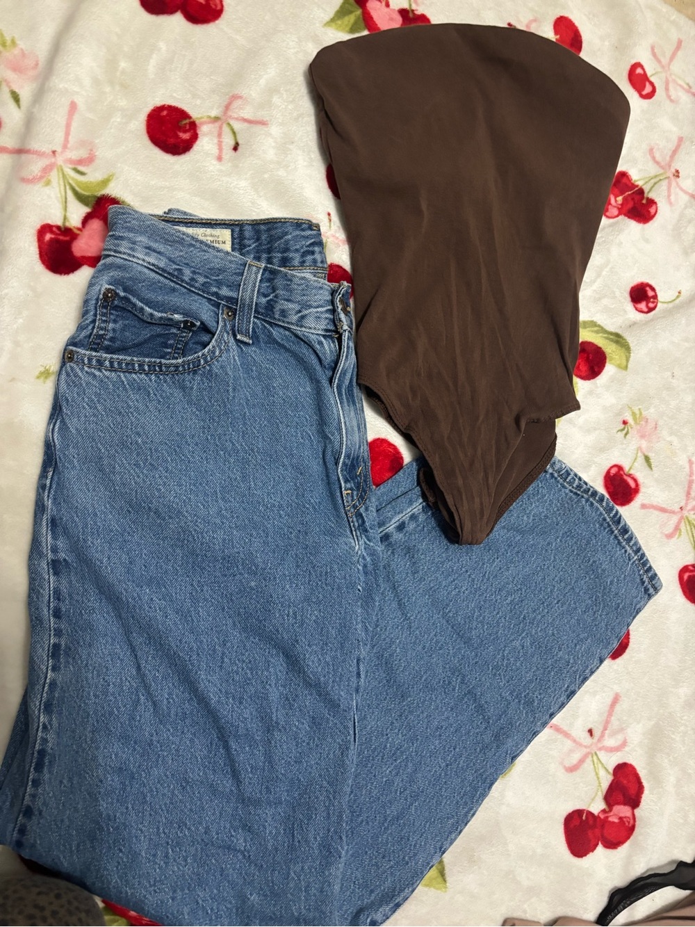 Levi's High-Rise Light Blue Jeans with Brown Accent